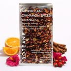 BOTEANE Moroccan Cinnamon Spiced Oranges tea package with cinnamon sticks, oranges, and flowers on a white background