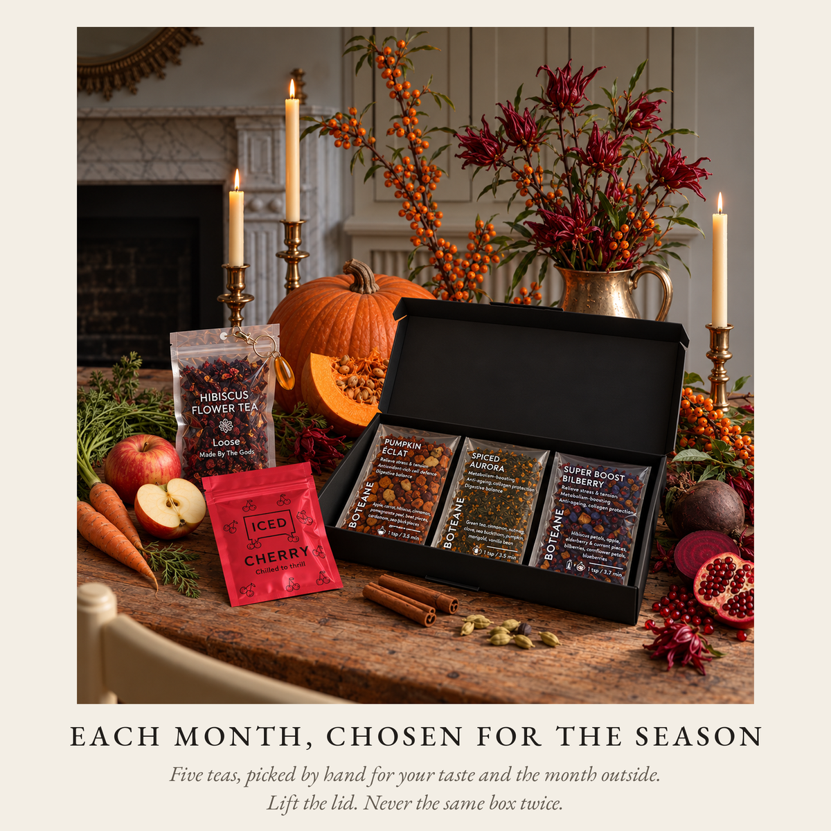 The season, chosen for you: a Boteane Discovery box opened on an autumn table with five loose leaf tea pouches, pumpkin, apples and pomegranate. Five teas chosen to sit together, never the same box twice.