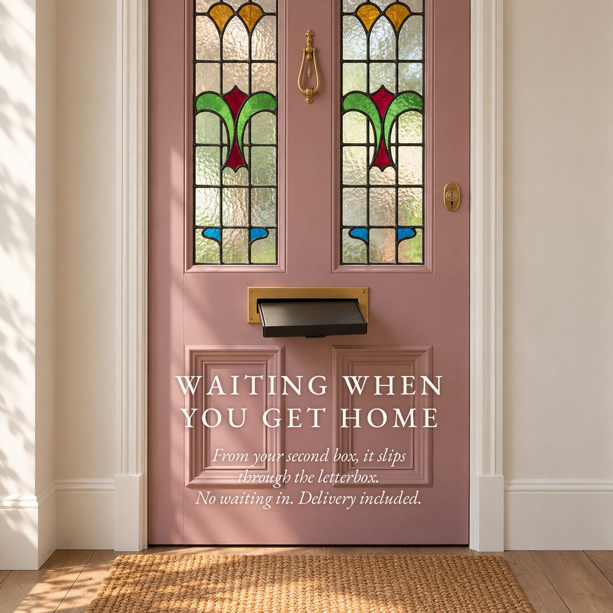 A Boteane Discovery box posted through the letterbox of a pink front door. Chosen with care, waiting when you get home.