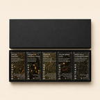 Set of Botane tea boxes with black lids and visible branding on a beige background
