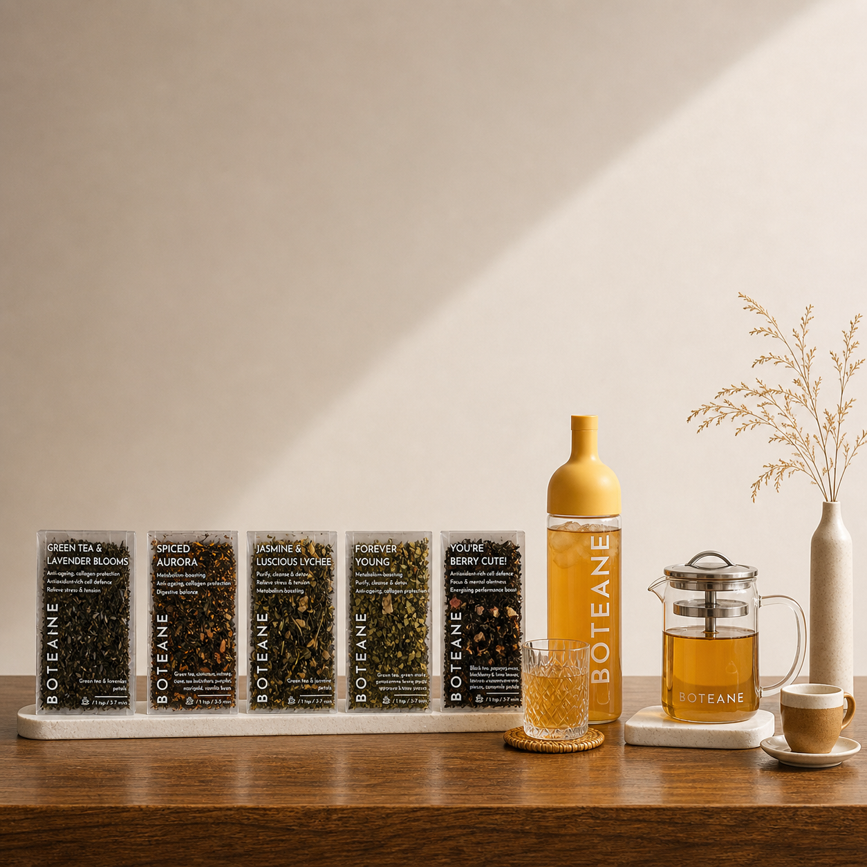 Boteane tea packaging and brewing setup on a wooden surface with a neutral background