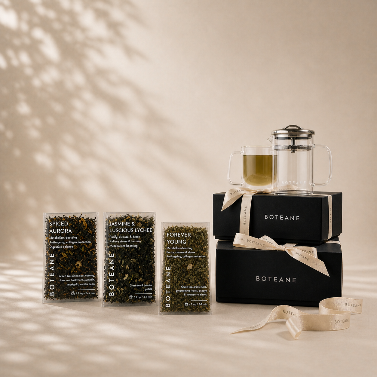 Boteane tea packaging and a French press on a beige background