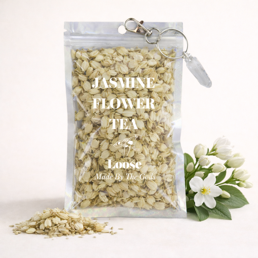 Packaged jasmine flower tea with a keychain and jasmine flowers on a white background