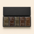 Set of Boteane tea boxes with various flavors on a beige background