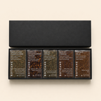 Set of Boteane tea boxes with various flavors on a beige background