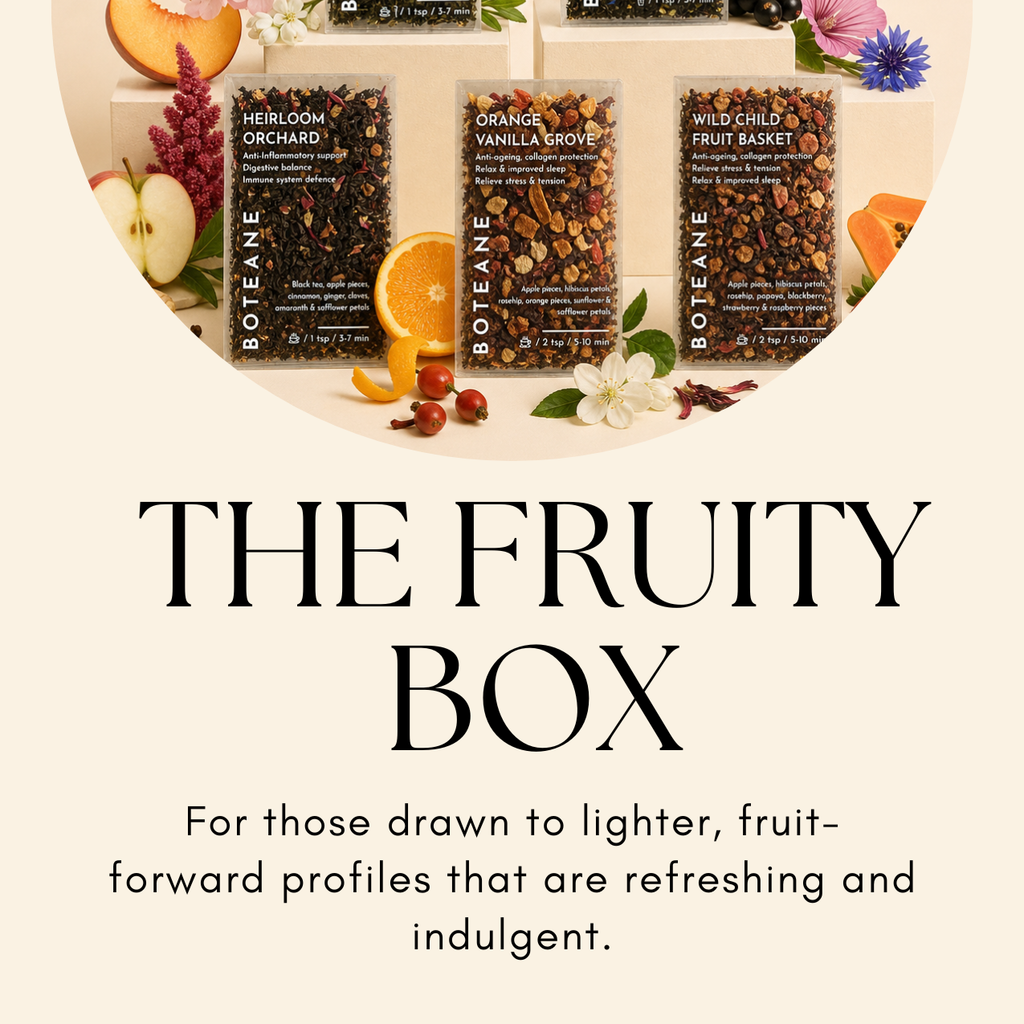 Boteane fruit boxes with fruits and flowers on a white background