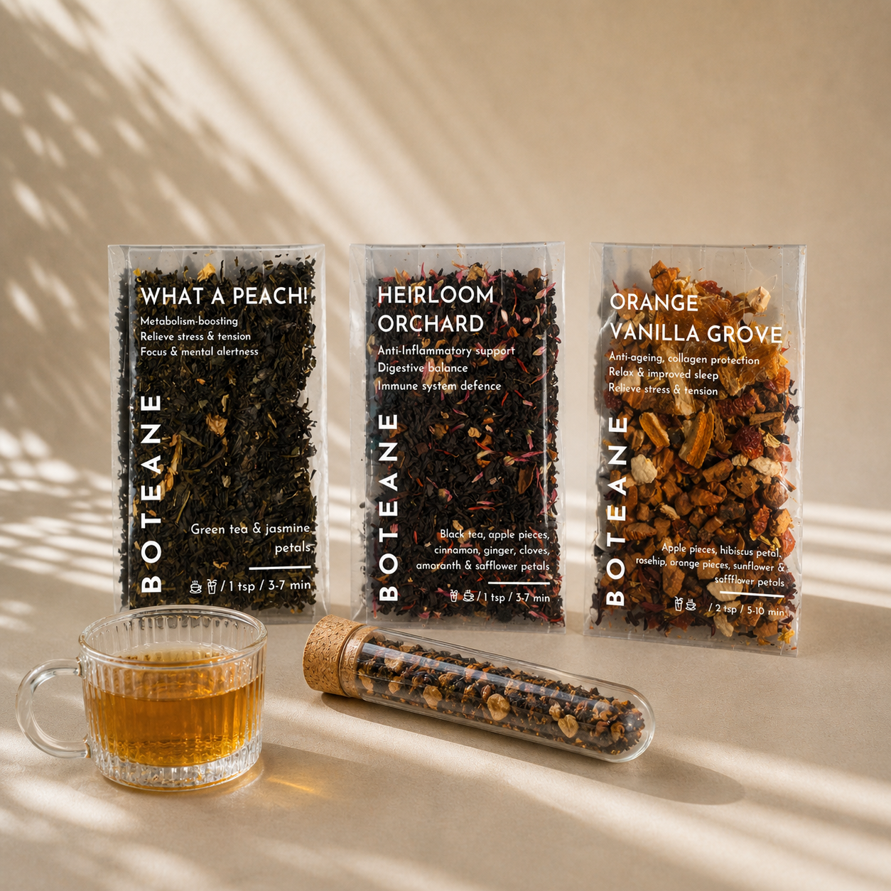 Three packages of BOTEANE tea with a glass of tea on a beige background