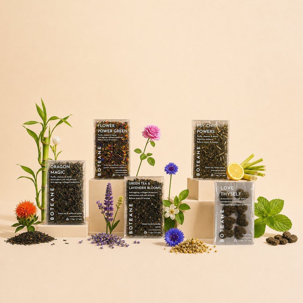 Collection of Roanea tea packages with various herbs and flowers on a beige background