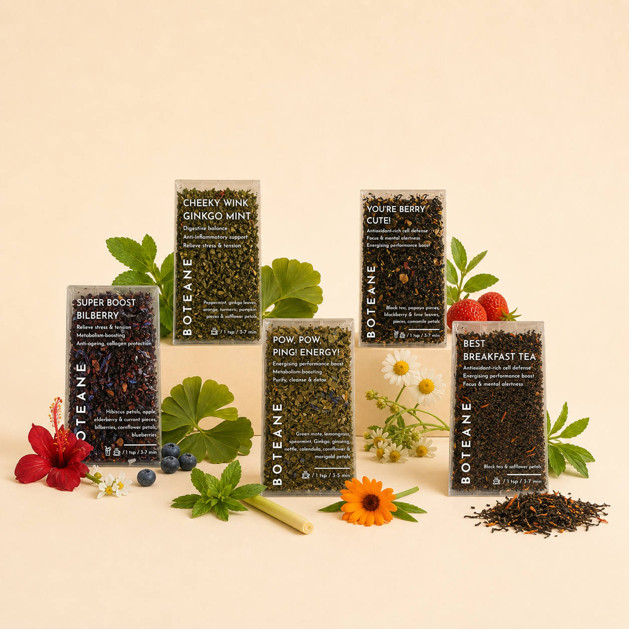 Collection of Boteane tea packages with botanical elements on a beige background