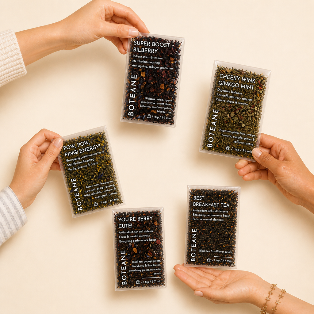 Five Boteane tea packages held by hands on a beige background