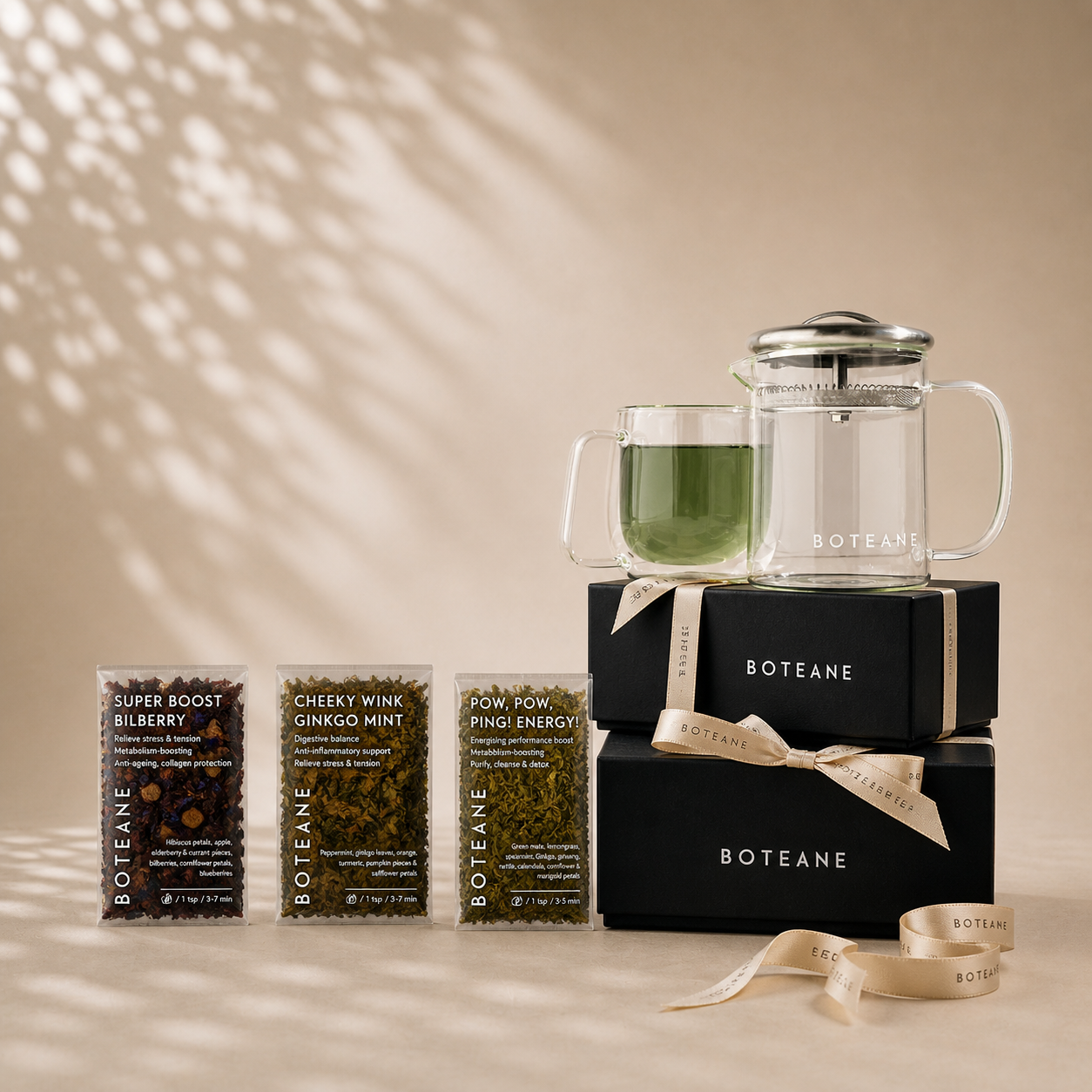 Boteane tea packaging and brewing set on a beige background