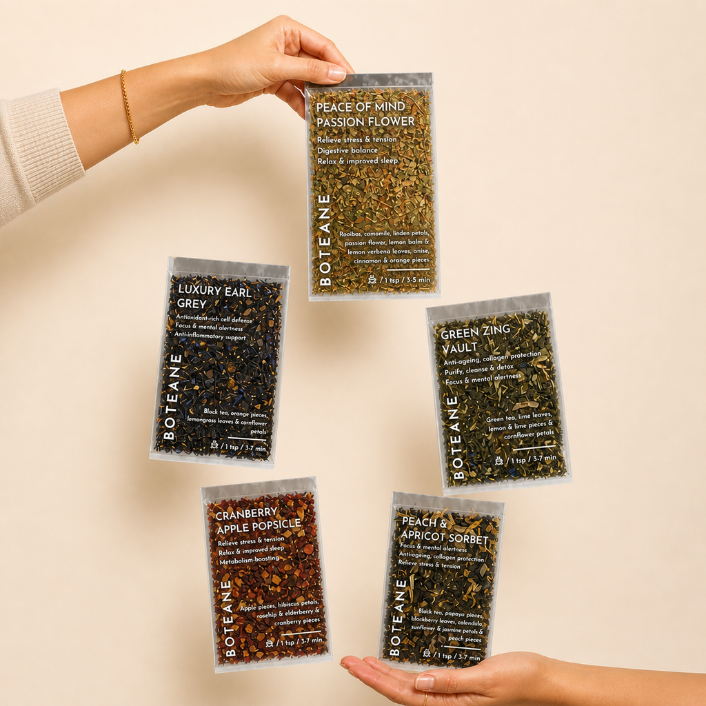 Five packages of Boiteane tea on a beige background
