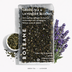Boteane green tea and lavender blooms packaging with tea leaves and lavender flowers on a white background