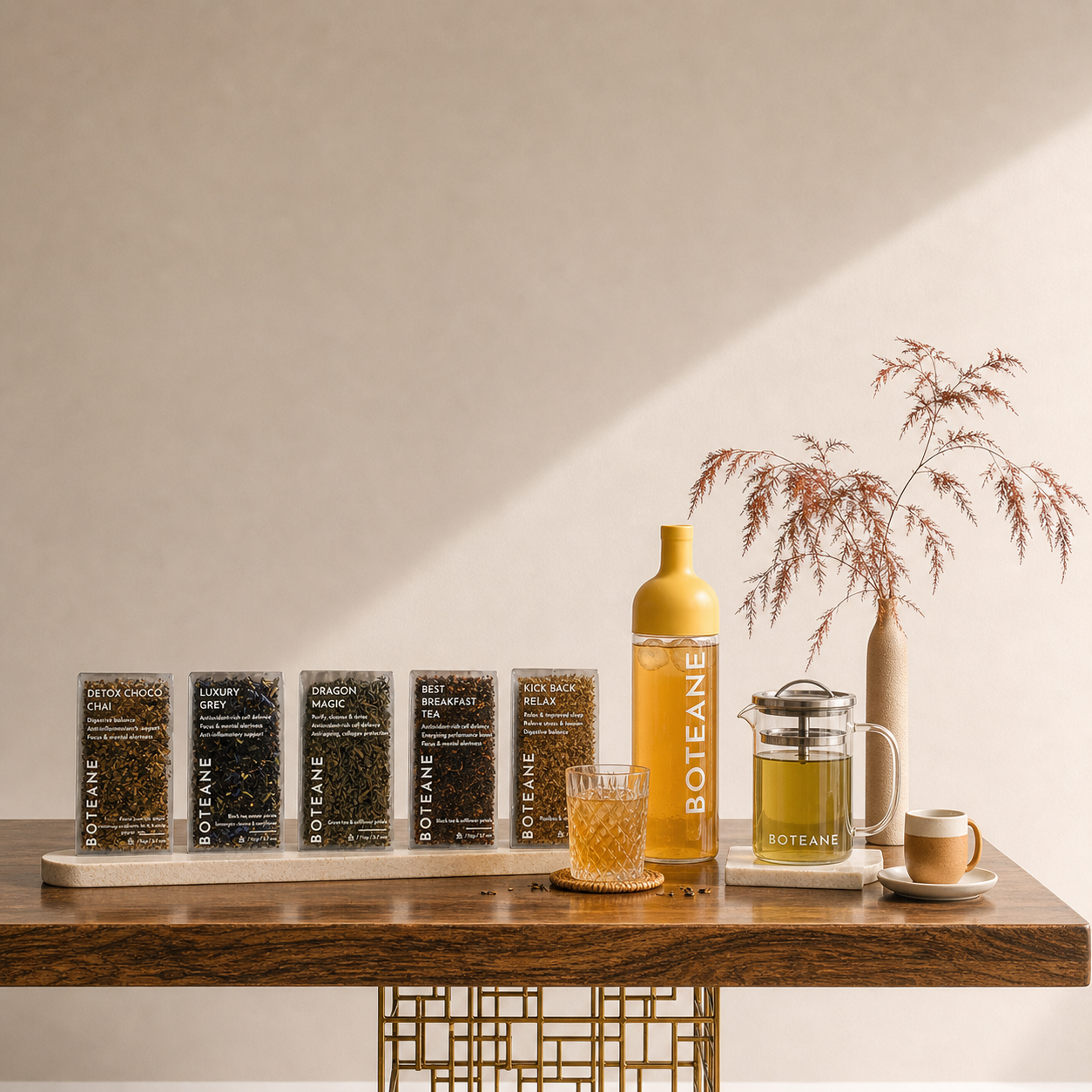 Bottle of Botane on a wooden table with tea-making setup and decorative elements.