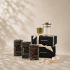 Boteane tea packaging and glass teapot on a neutral background