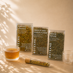 Boteane tea packages with a cup of tea on a beige background