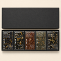 Boteane chocolate packaging with five different flavors on a beige background